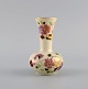 Zsolnay vase in cream-colored porcelain with hand-painted flowers, butterflies and gold ...