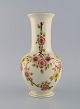 Zsolnay vase in cream-colored porcelain with hand-painted flowers and gold 
decoration. Late 20th century.
