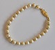 Pearl bracelet with gold-plated clasp, 20th century. With 24 pearls. Inside diameter: 6 ...