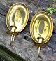 A pair of brass light shields, 19th century Denmark. Oval shields. Each with one light arm. H .: ...