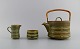 Jens H. 
Quistgaard 
(1919-2008) for 
Bing & 
Grøndahl. Rune 
teapot with 
wicker handle, 
sugar bowl ...