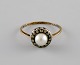 Swedish jeweler. Vintage art deco ring in 18 carat gold adorned with cultured 
pearl and marcasite stones. 1920s / 30s.
