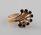Swedish 
jeweler. Large 
vintage ring in 
14 carat gold 
adorned with 
faceted 
sapphires and 
...