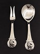 Serving cutlery 
with grape 
spoon sold 23.5 
cm. fork 22 cm. 
three-towered 
silver from L. 
Green ...