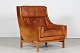 Erik Jørgensen (1925-2002)Lounge chair with frame of solid oakupholstered with cognac ...