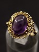 14 carat gold 
ring size 57 
with cabochon 
cut amethyst 
1.1 x 1.4 cm. 
item no. 502594