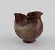 European studio ceramist. Small unique vase / jug in glazed stoneware. Beautiful 
luster glaze. 1960s / 70s.
