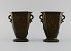 Just Andersen 
(1884-1943), 
Denmark. A pair 
of disko metal 
vases. Wavy 
handles. Woman 
holding ...