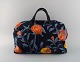 Josef Frank for Svenskt Tenn. Colorful bag with floral motifs. Handles and lock in leather and ...