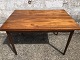 Teak veneer dining table with solid teak legs and 2 pull-out tops. Danish modern from the 1960s. ...