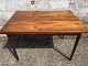 Teak veneer 
dining table 
with solid teak 
legs and 2 
pull-out tops. 
Danish modern 
from the 1960s. 
...