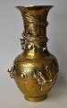 Chinese bronze vase, 20th century. Decorated with sleek dragons. Corpus richly decorated with ...
