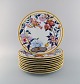 Porcelaine de Paris. "Aurore Tropicale". 10 porcelain cover plates decorated with flowers and ...