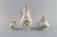 Rosenthal Sans Souci coffee pot, sugar bowl and cream jug. Hand-painted flowers, 
foliage in relief and gold edge. 1950s.
