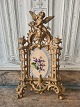 Large old 
picture frame 
decorated with 
an angel on top 
of the frame
Measure 21.5 x 
35 cm.