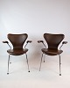 A set of seven 
chairs, model 
3207, with arms 
in dark brown 
colored leather 
designed by 
Arne ...