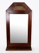 Antique mirror 
in mahogany 
wood from 
around the 
1890s.
H:67 W:36 D:10
