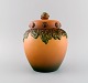 Ipsen's, 
Denmark. Lidded 
vase in 
hand-painted 
and glazed 
ceramics. 1920s 
/ 30s. Model 
number ...