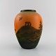 Ipsen's, 
Denmark. Vase 
in glazed 
ceramics. 
Hand-painted 
landscape with 
burial mound. 
1920s / ...