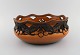 Ipsen's, 
Denmark. Large 
bowl in 
openwork 
ceramics with 
hand-painted 
leaves and 
berries. 1920s 
/ ...