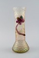 Lötz art 
nouveau vase in 
frosted 
mouth-blown art 
glass with 
purple flowers 
in relief. 
Approx. ...