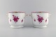 Herend Chinese Bouquet Raspberry. Two wine coolers in hand-painted porcelain 
modeled with handles. Pink flowers and gold decoration. Mid-20th century.
