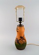 Ipsen's, Denmark. Table lamp in glazed ceramics with hand-painted birds, branches and foliage. ...