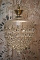 Old Swedish prism lamp with lots of fine clear glass prisms. Has a light source in the middle. ...