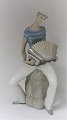 LLadro. 
Porcelain 
figure. 
Accordion man. 
Height 34.5 cm