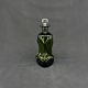 Height 16 cm.Kluk flask in olive green glass with round stopper from Holmegaard.The ...