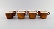 Stig Lindberg for Gustavsberg. Eight Coq coffee cups in glazed stoneware. 
Beautiful glaze in brown shades. Swedish design, 1960s.
