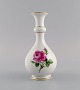 Meissen Pink Rose vase in hand-painted porcelain with gold edges. Early 20th century.Measures: ...
