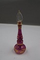 Nice and elegant perfume bottle of purple glass with gold decoration, as well as the original ...