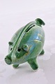 Piggy bank in 
green colored 
glaze. From 
Gouda 
Netherland. 
Ceramic pig, 
length 19 cm. 
height 8 ...