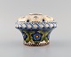 Aluminia faience vase with hand-painted flowers. Approx. 1910.Measures: 14 x 10 cm.In ...
