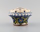 Aluminia 
faience vase 
with 
hand-painted 
flowers. 
Approx. 1910.
Measures: 14 x 
10 cm.
In ...