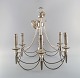 Six-armed chandelier in silver plate. Classic style. 1930's.Measures: 50 x 48 cm. In ...