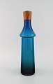Göran Wärff for Pukeberg. Large Tropico decanter in blue mouth-blown art glass with teak ...