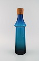 Göran Wärff for 
Pukeberg. Large 
Tropico 
decanter in 
blue 
mouth-blown art 
glass with teak 
...