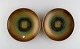 Zicu, Sweden. Two art deco dishes / bowls in patinated metal with faces in relief. Mid 20th ...