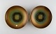 Zicu, Sweden. 
Two art deco 
dishes / bowls 
in patinated 
metal with 
faces in 
relief. Mid 
20th ...