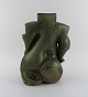 French studio potter. Organically shaped unique vase in glazed stoneware. 
Beautiful glaze in dark green shades. Sculptural design, 1980s.
