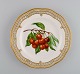 Royal Copenhagen Flora Danica fruit plate in openwork porcelain with 
hand-painted berries and gold decoration. Model number 429/3584. Dated 1965.
