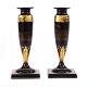 Pair of black lacquered candlesticks with gilt landscape and ornamental decorationsEngland ...