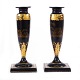 Pair of black 
lacquered 
candlesticks 
with gilt 
landscape and 
ornamental 
decorations
England ...