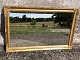 Faceted mirror in gold-painted frame. Some traces of use. 84x54 cm