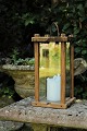 Old Swedish 1800s wooden lamp with glass on all 4 sides. The lamp has a very nice patina and ...