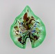 Leaf-shaped Murano bowl in polychrome mouth blown art glass. Green background. 
Italian design, 1960s.
