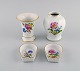 Meissen, Germany. Two vases and two small bowls in hand-painted porcelain with flowers and gold ...