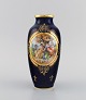 Antique Wien 
vase in 
hand-painted 
porcelain. 
Classic motifs 
and gold 
decoration on a 
dark blue ...